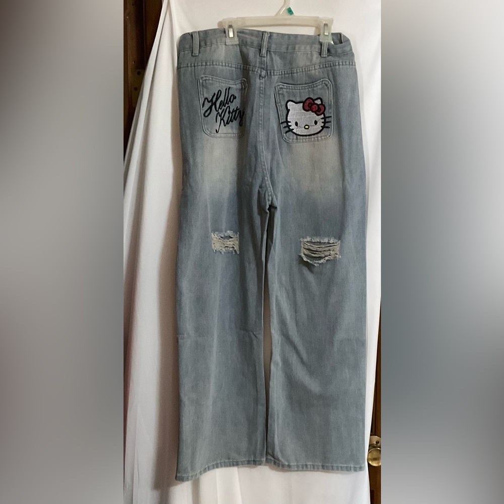 Hello Kitty: Embroidered back of light blue loose fit denim jeans. Street wear.
